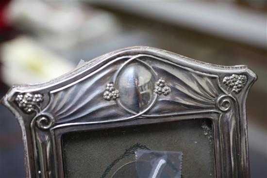 An Edwardian Art Nouveau repousse silver photograph frame, 11.25in.